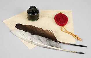 Abbildung eines Federkiels und eines Siegellacks