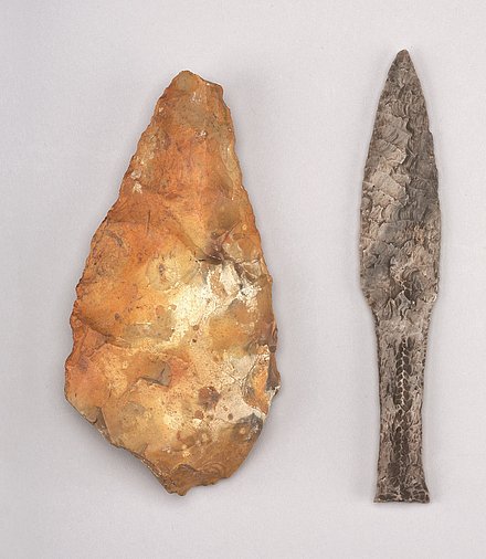 Photograph of a hand axe and a fishtail dagger from the Stone Age.