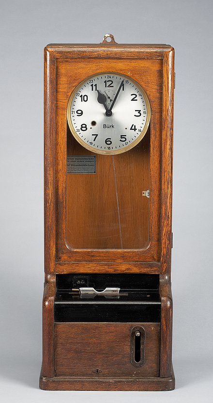 Photograph of a time clock from the 1950s.