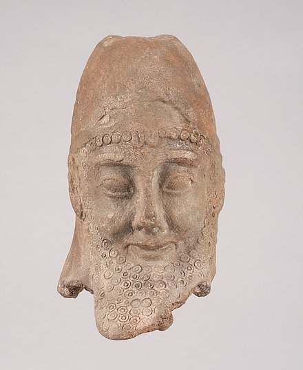 Image of an imitation or forgery of a bearded male head from Cyprus.